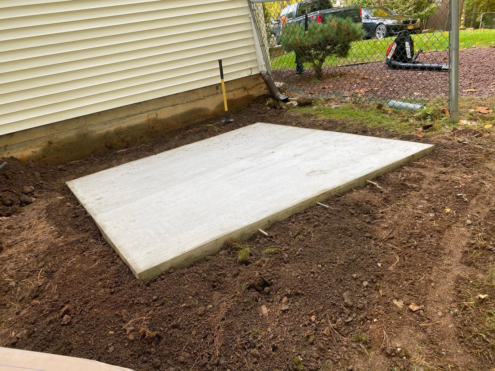 Cured concrete pad after form-strip