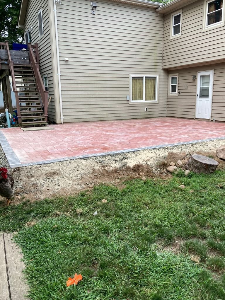 Large red stamped-concrete patio extension
